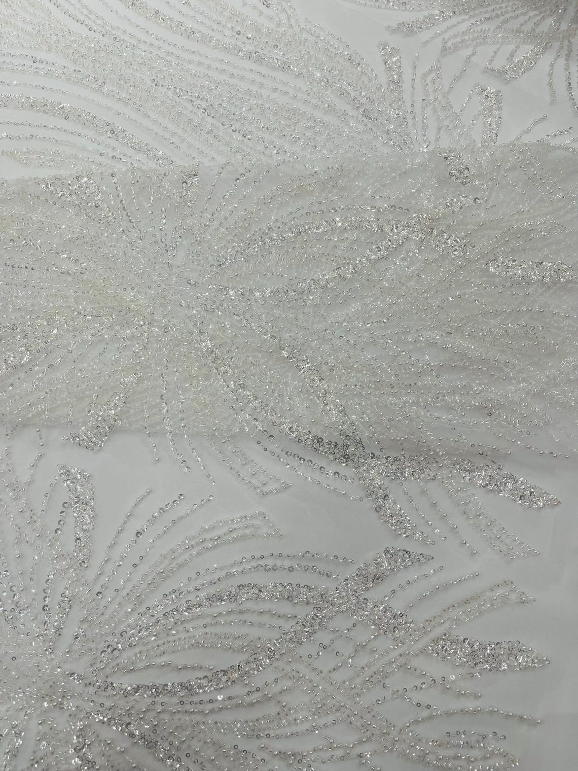 BRIDAL - WHITE - Designs Embroider with Sequins and Heavy Beaded on a Mesh Lace Fabric - Sold By The Yard