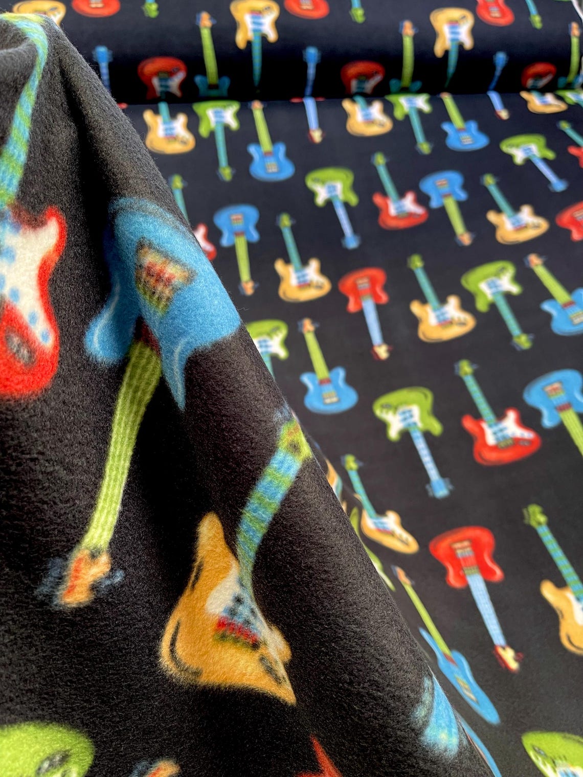 Multicolored Guitar with Black Background, Anti Pill Theme Fleece Fabric, 60” Inches Wide – Sold By The Yard