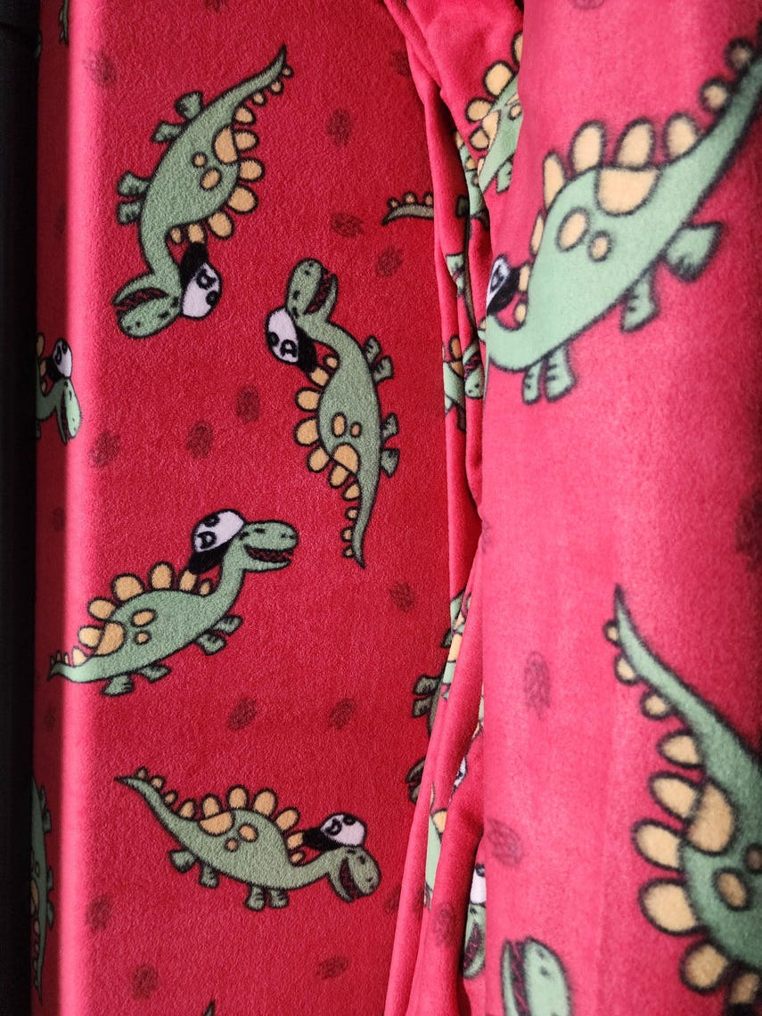 Red Dinosaur Print Anti Pill Theme Fleece Fabric, 60” Inches Wide – Sold By The Yard