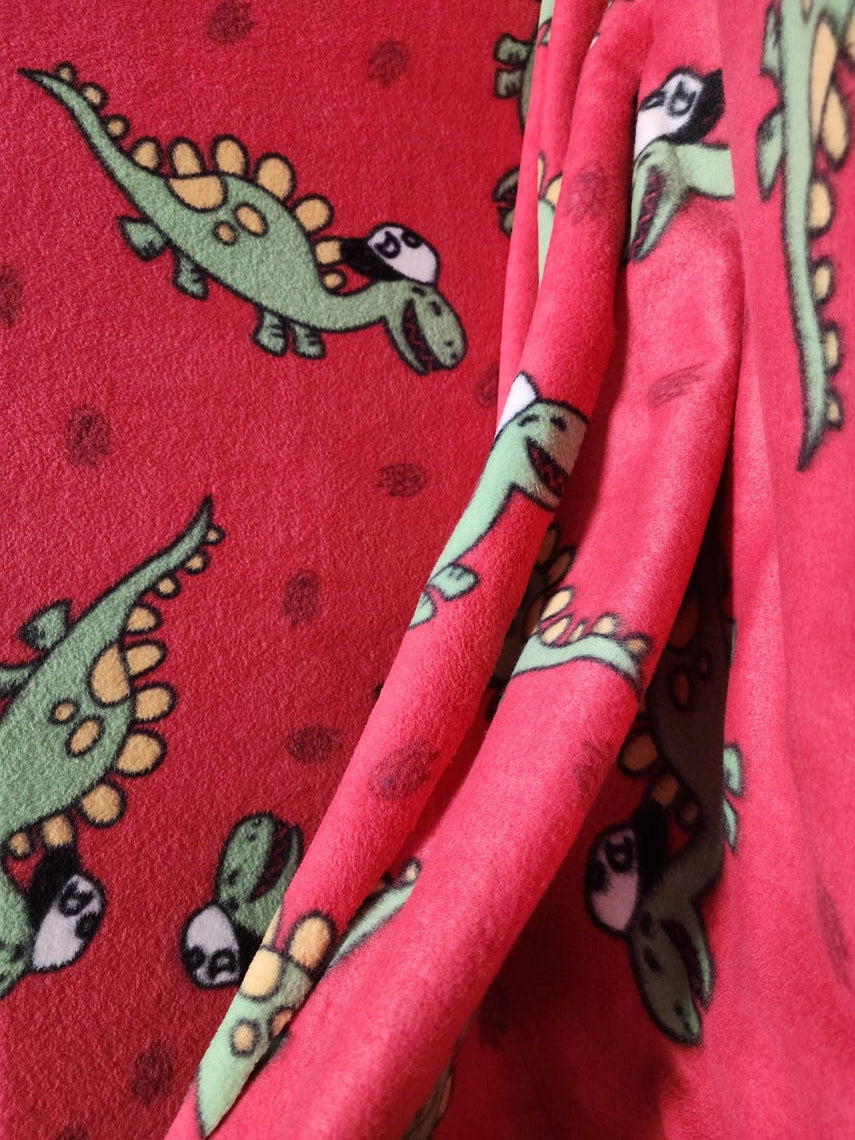 Red Dinosaur Print Anti Pill Theme Fleece Fabric, 60” Inches Wide – Sold By The Yard