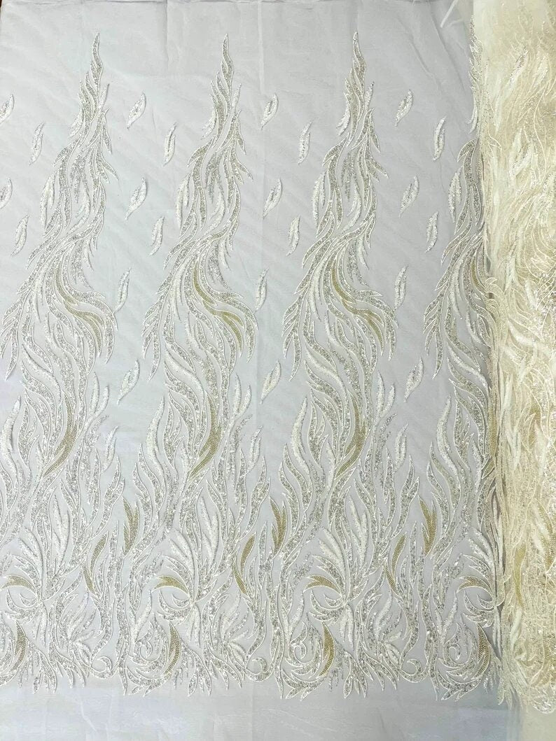 Fire Feather Designs embroider with sequins and heavy beaded on a mesh lace fabric-sold by the yard-
