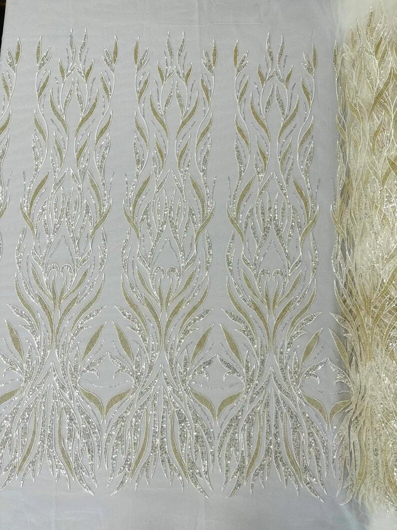 Flames Feather Designs embroider with sequins and heavy beaded on a mesh lace fabric-sold by the yard-