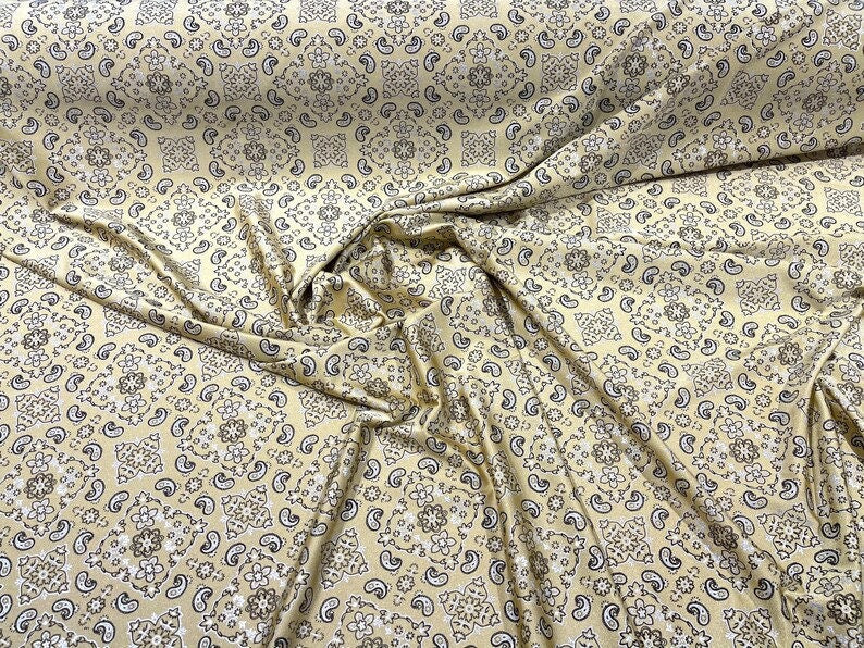 Metallic Bandanna Print on a Stretch Tricot Spandex Fabric- Sold by Yard. Light Gold